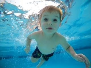Boy Swimming in Water
